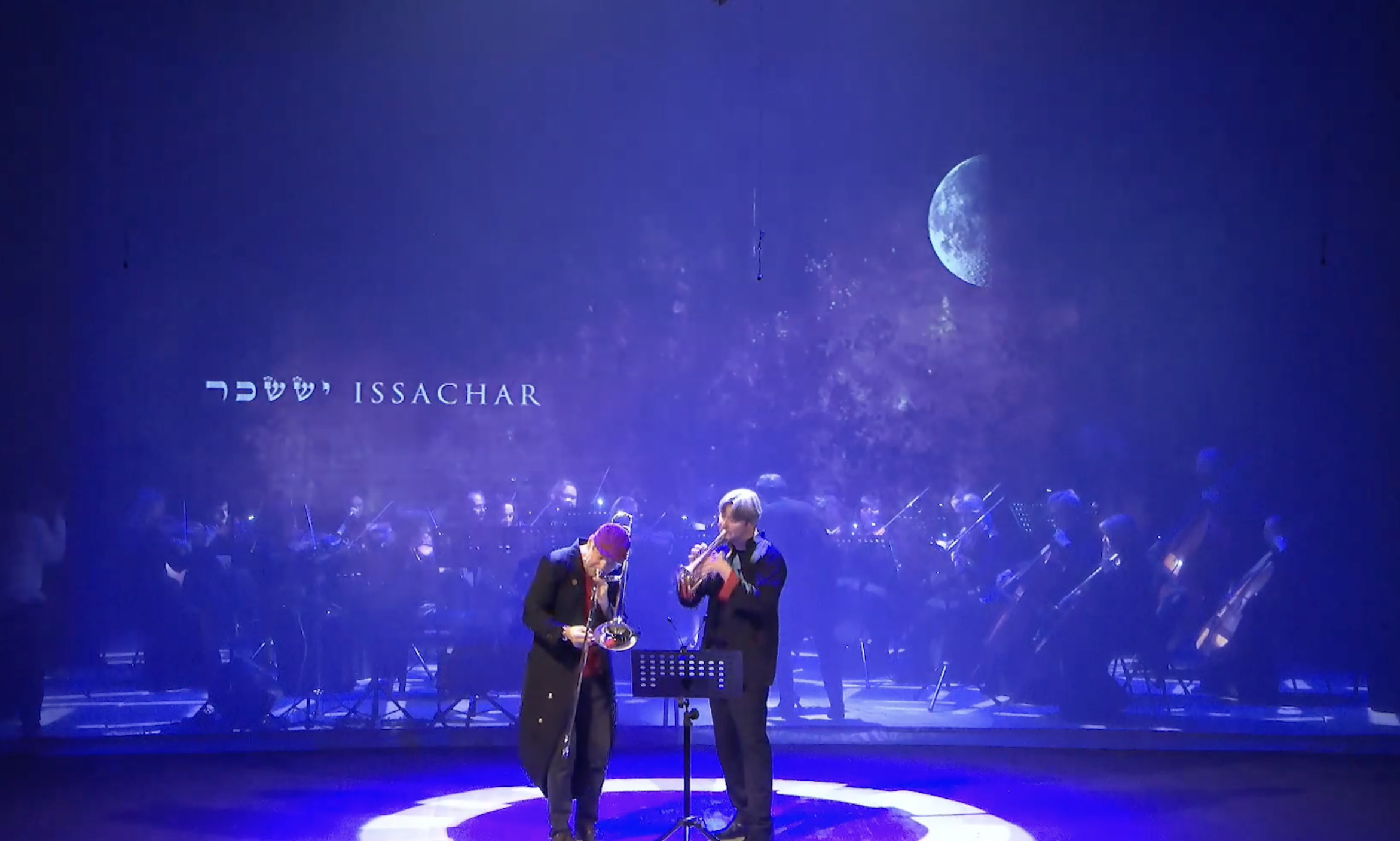 Soloists and orchestra with lunar motif.