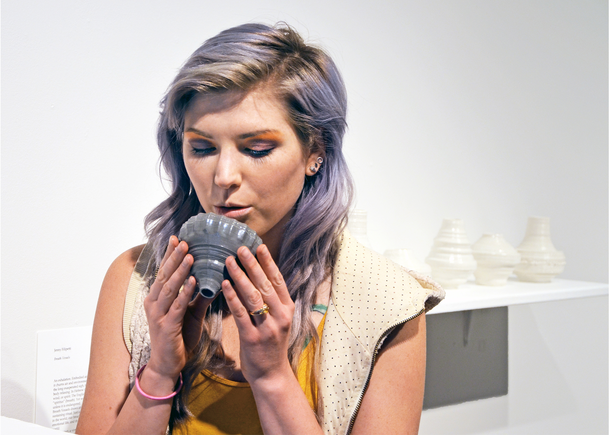 A visitor exhales into a Breath Vessel